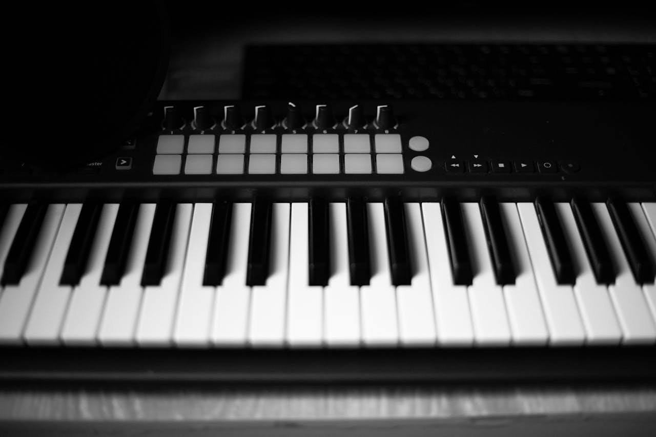 Close-up of a black and white digital MIDI keyboard in soft focus.